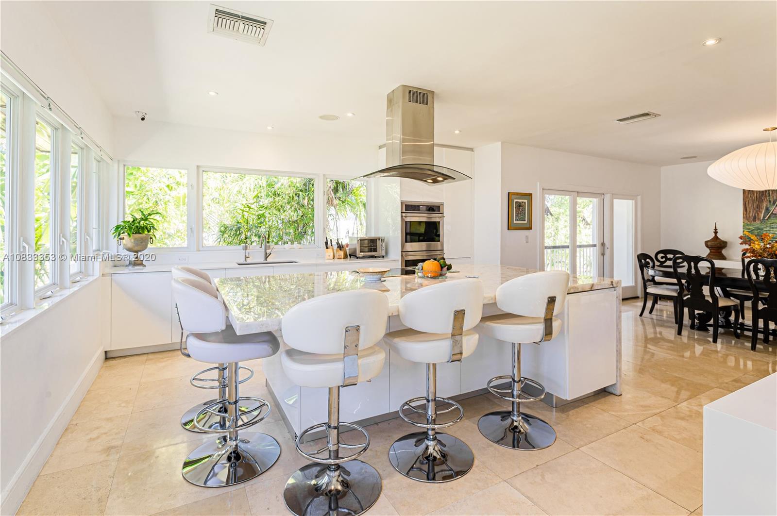 472 Warren Lane Key Biscayne, FL 33149 - Photo 20 of 39 a living room with furniture kitchen view and large windows