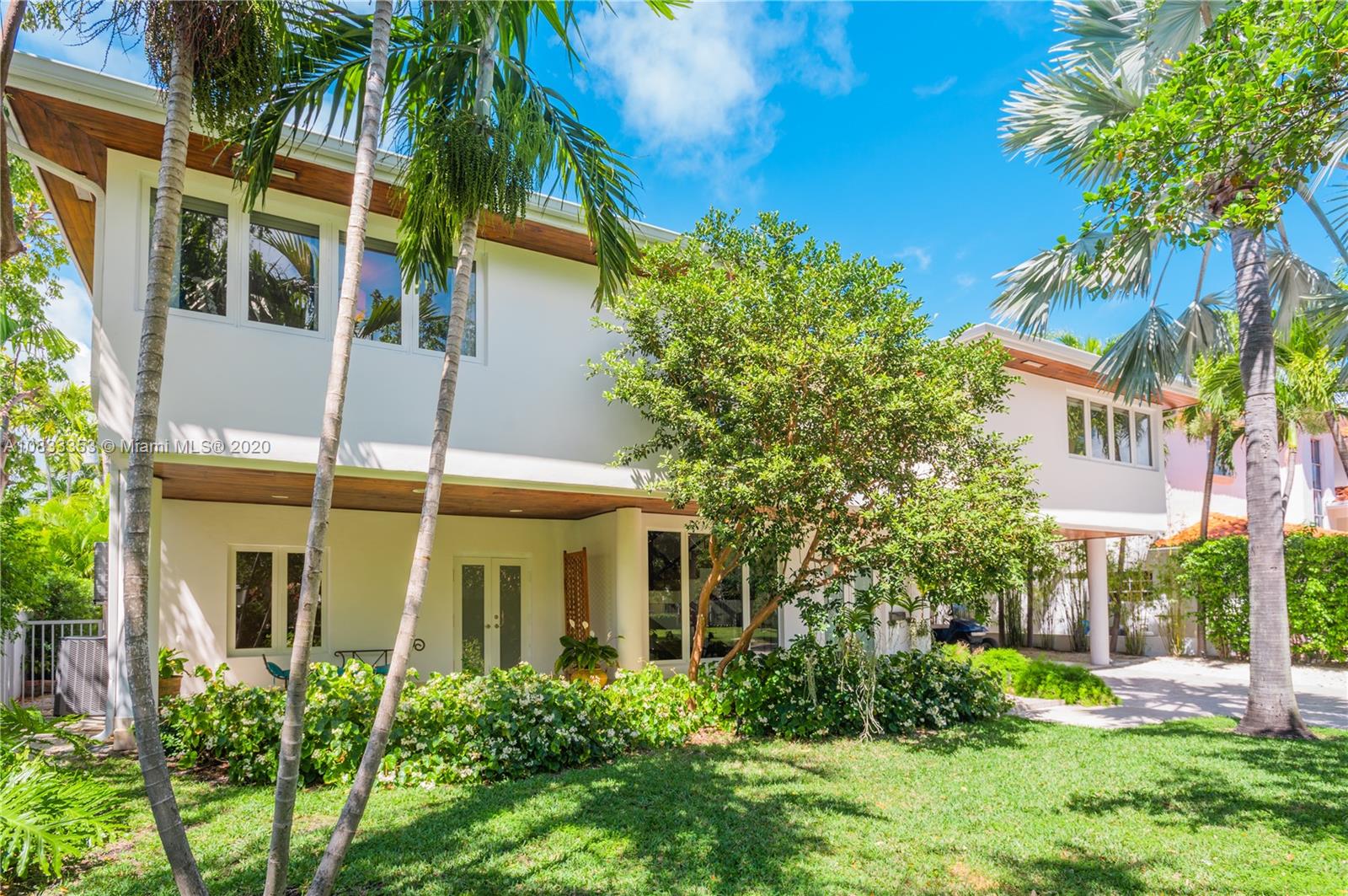 472 Warren Lane Key Biscayne, FL 33149 - Photo 2 of 39 a view of a house with a tree