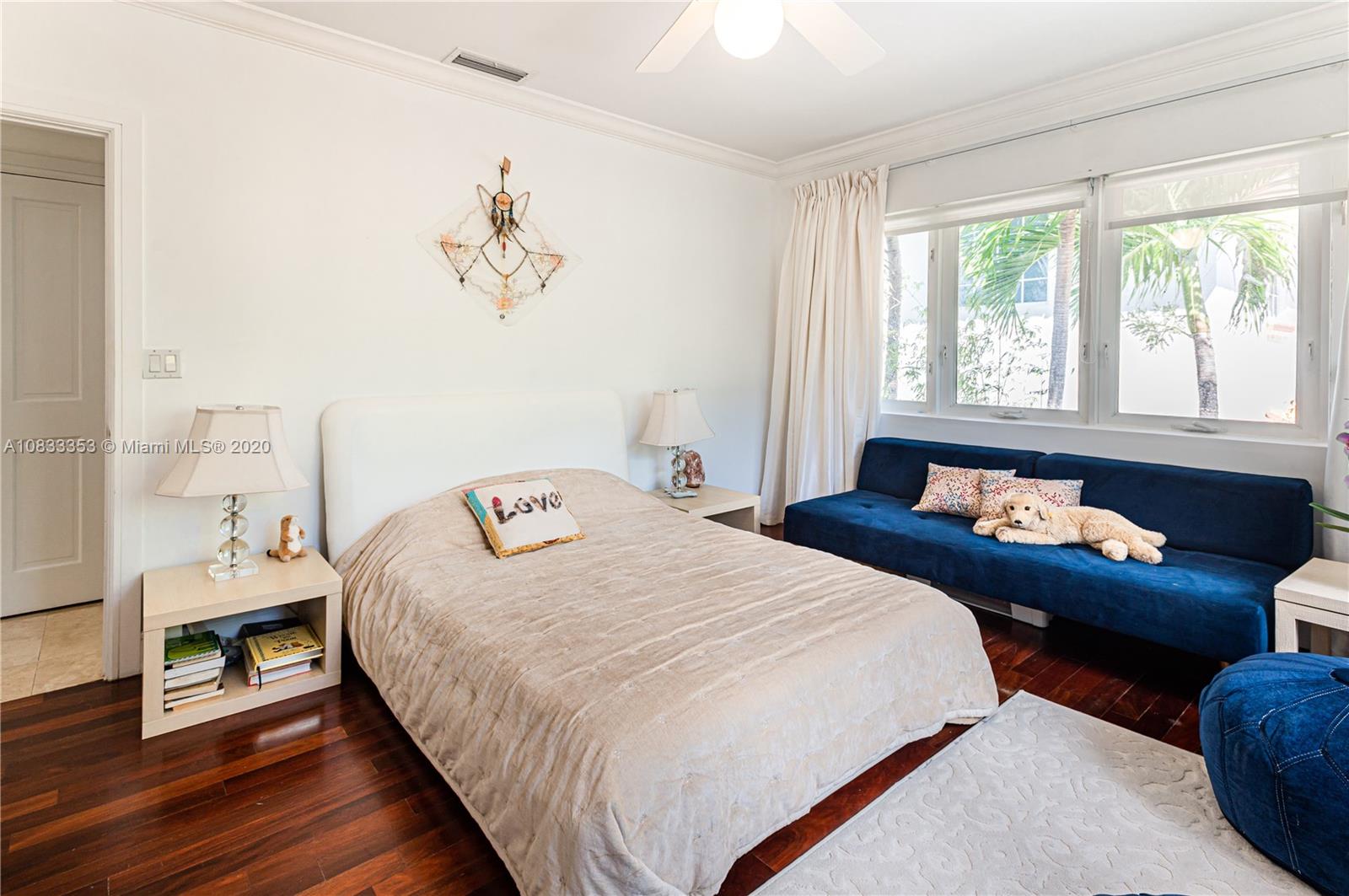 472 Warren Lane Key Biscayne, FL 33149 - Photo 30 of 39 a bedroom with bed and a window