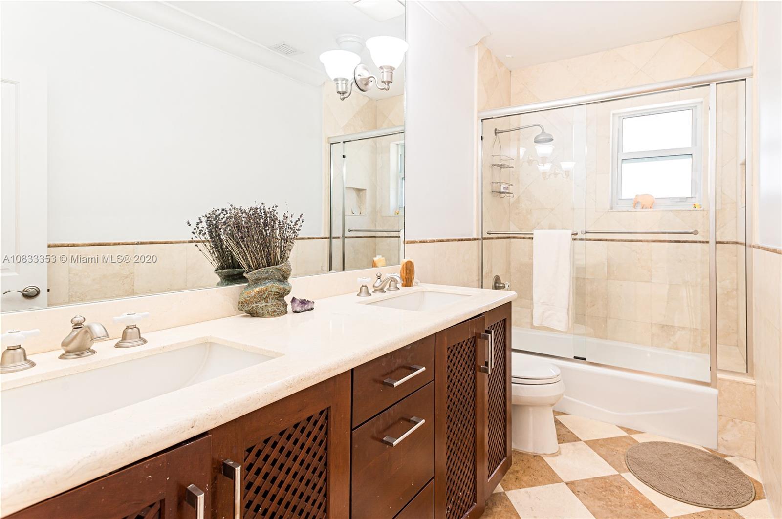 472 Warren Lane Key Biscayne, FL 33149 - Photo 31 of 39 a bathroom with a sink vanity granite and a mirror