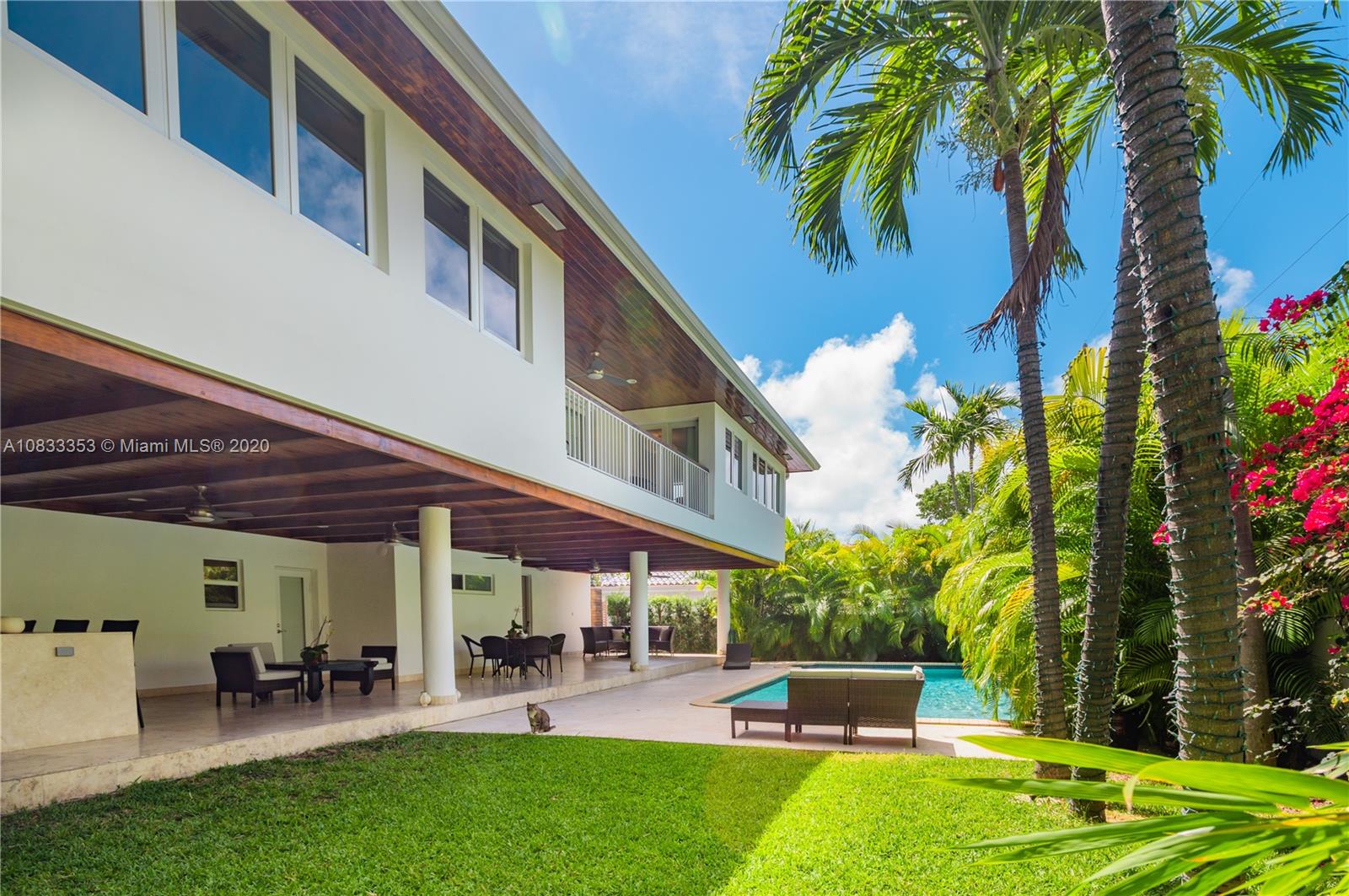 472 Warren Lane Key Biscayne, FL 33149 - Photo 37 of 39 a view of a patio with table and chairs and potted plants
