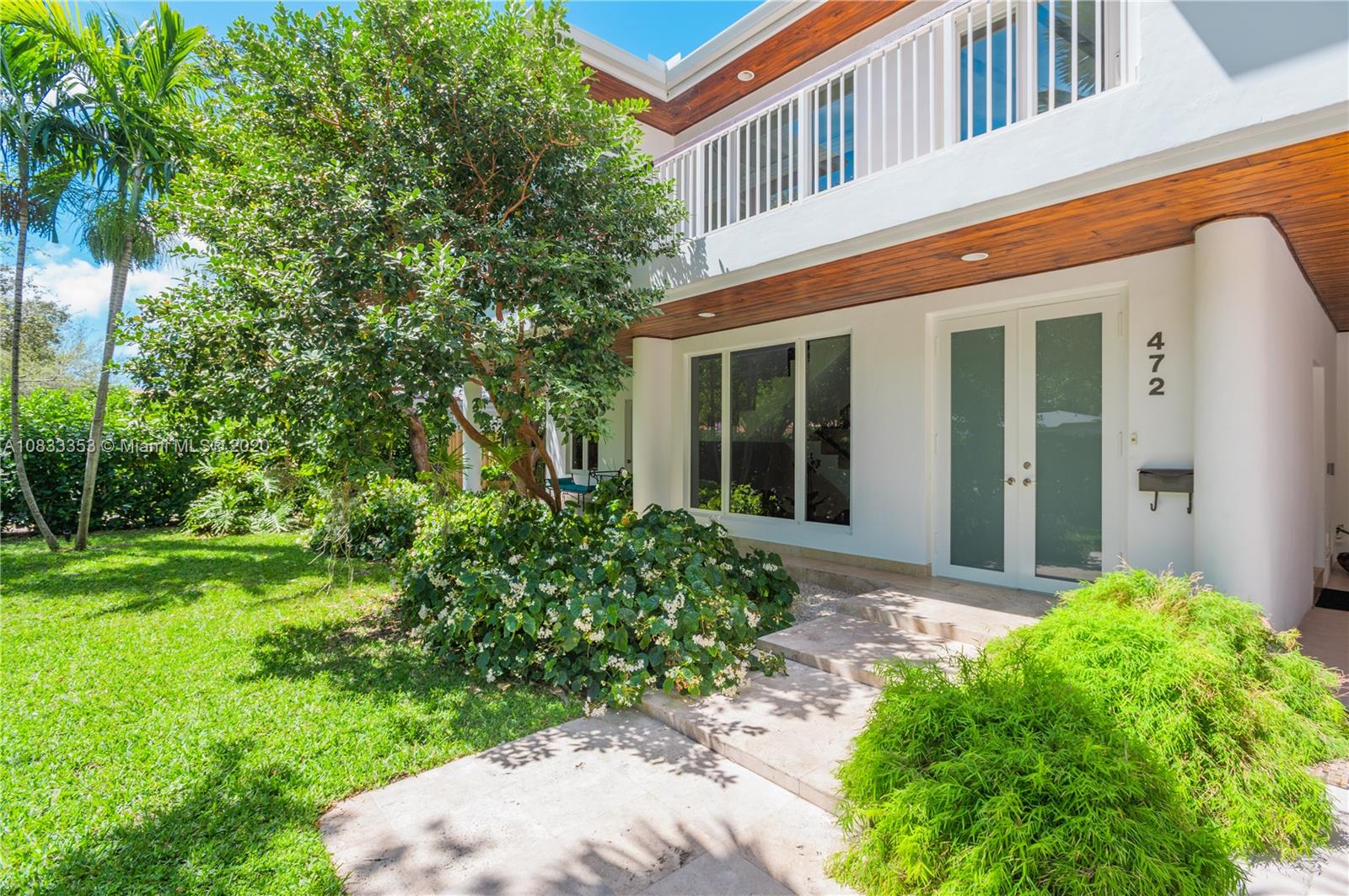 472 Warren Lane Key Biscayne, FL 33149 - Photo 4 of 39 front view of a house with a yard