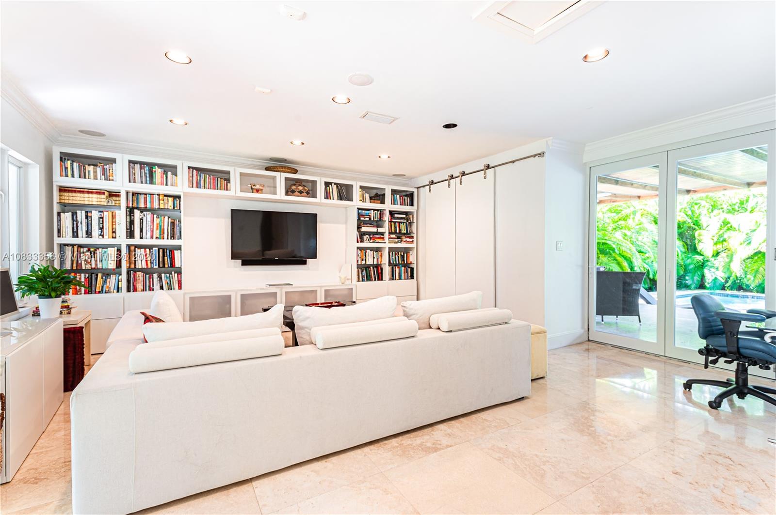 472 Warren Lane Key Biscayne, FL 33149 - Photo 6 of 39 a living room with furniture and a flat screen tv