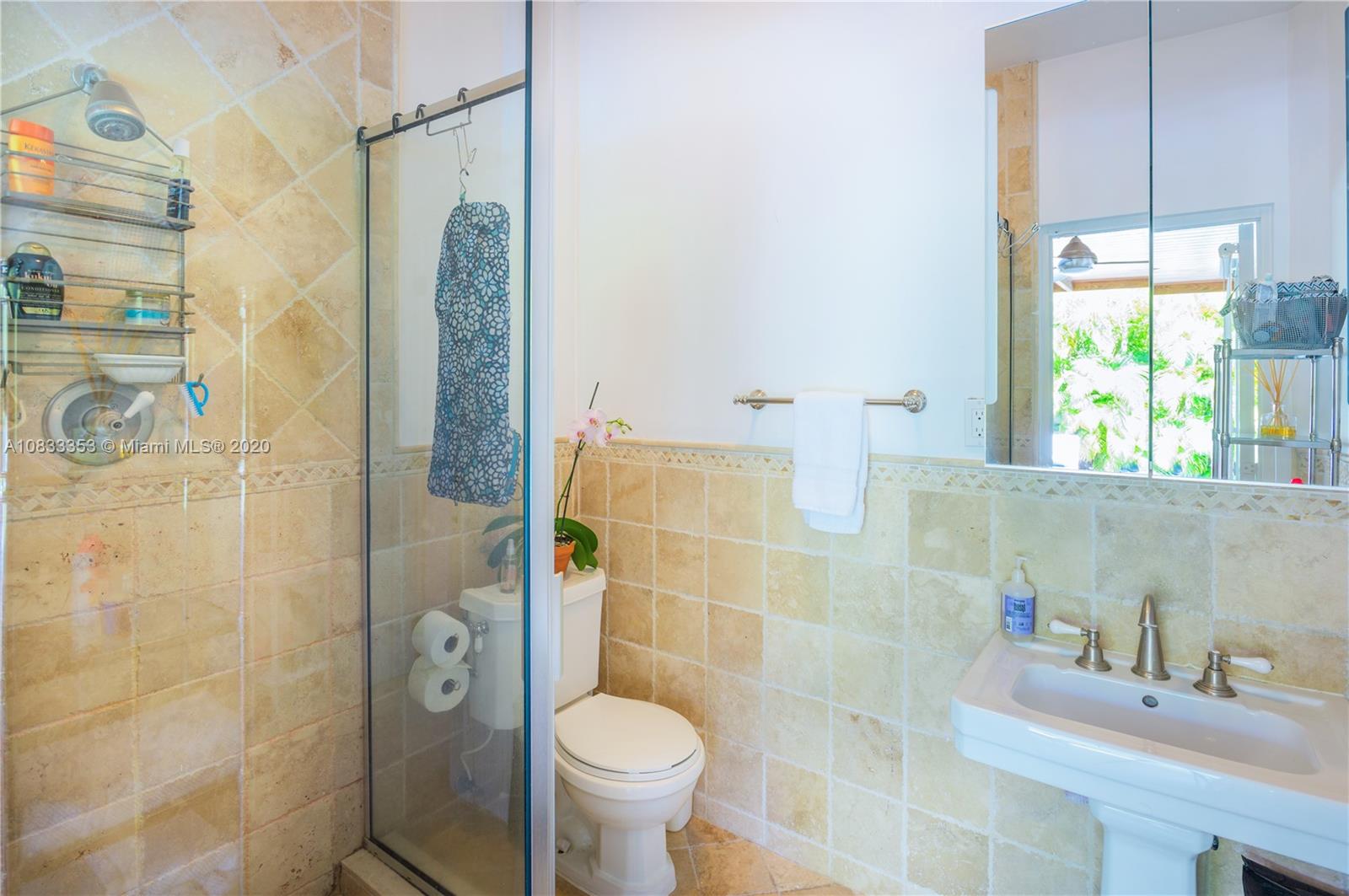 472 Warren Lane Key Biscayne, FL 33149 - Photo 8 of 39 a bathroom with a sink toilet and shower