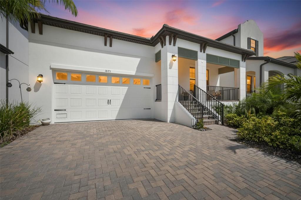 1071 Seagrape Drive Ruskin, FL 33570 - Photo 1 of 100 a front view of a house with a yard and garage