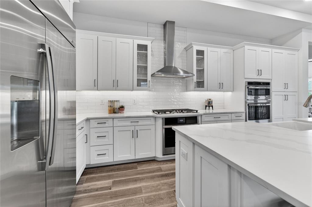 1071 Seagrape Drive Ruskin, FL 33570 - Photo 12 of 100 a kitchen with stainless steel appliances a sink stove and refrigerator