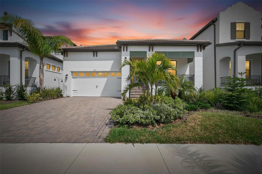 1071 Seagrape Drive Ruskin, FL 33570 - Photo 2 of 100 a front view of a house with garden