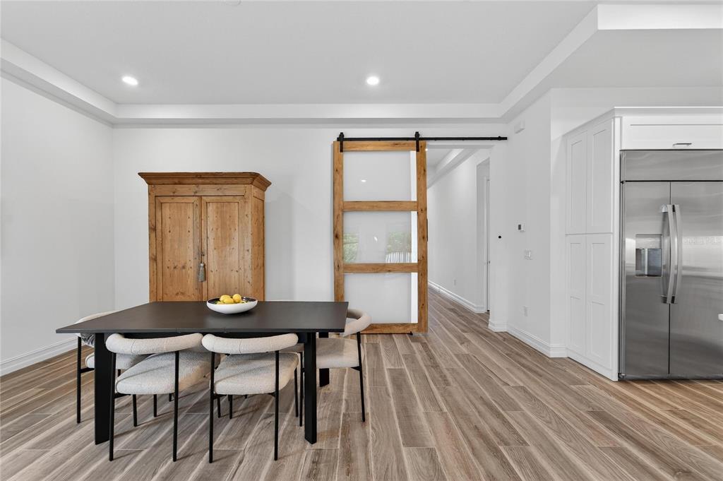 1071 Seagrape Drive Ruskin, FL 33570 - Photo 21 of 100 a view of a room with furniture and wooden floor