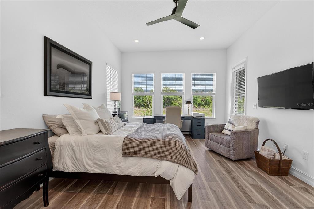 1071 Seagrape Drive Ruskin, FL 33570 - Photo 23 of 100 a bedroom with a bed and glass window