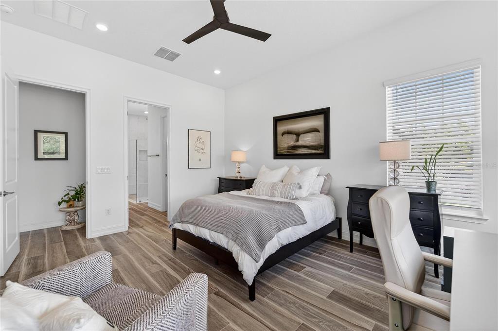 1071 Seagrape Drive Ruskin, FL 33570 - Photo 24 of 100 a spacious bedroom with a bed and a couch