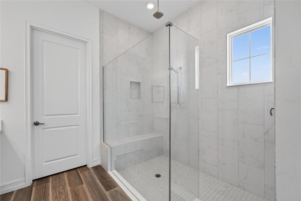 1071 Seagrape Drive Ruskin, FL 33570 - Photo 30 of 100 a bathroom with a bathtub and a shower