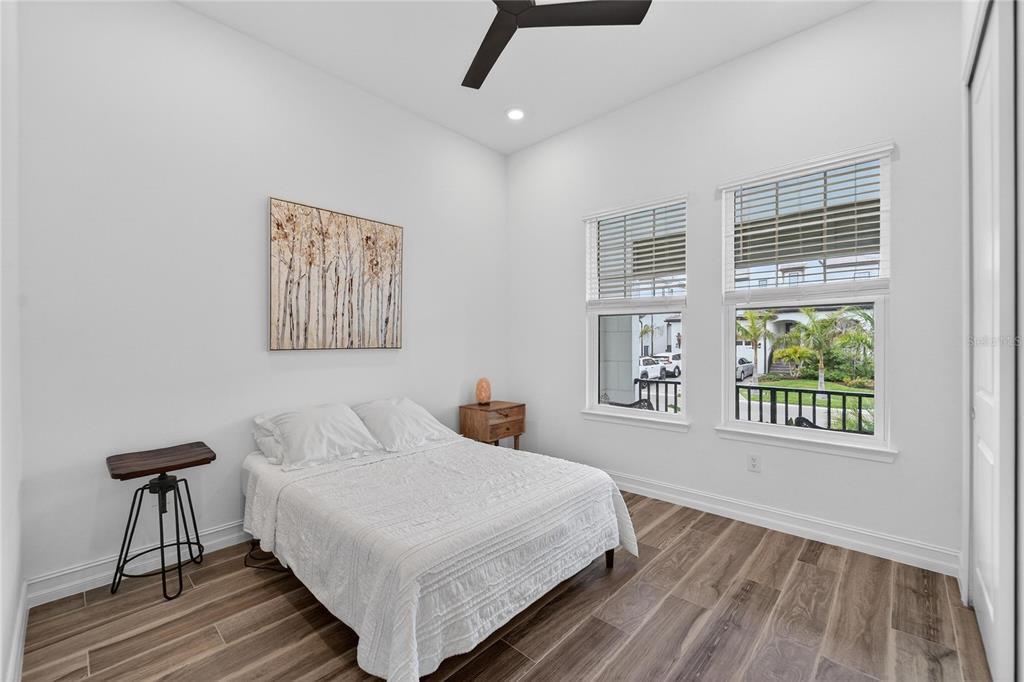 1071 Seagrape Drive Ruskin, FL 33570 - Photo 36 of 100 a bedroom with a large bed and a window