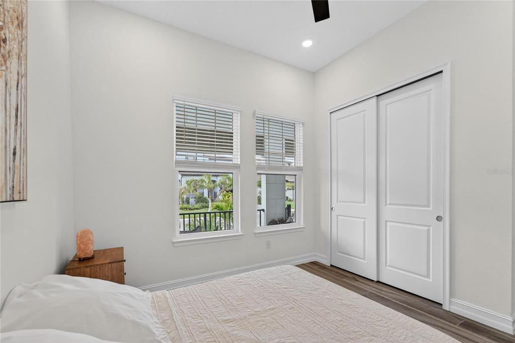 1071 Seagrape Drive Ruskin, FL 33570 - Photo 39 of 100 a bedroom with a bed and a window