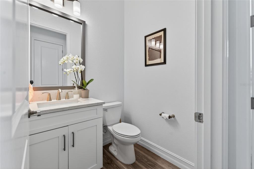 1071 Seagrape Drive Ruskin, FL 33570 - Photo 44 of 100 a bathroom with a toilet sink and mirror
