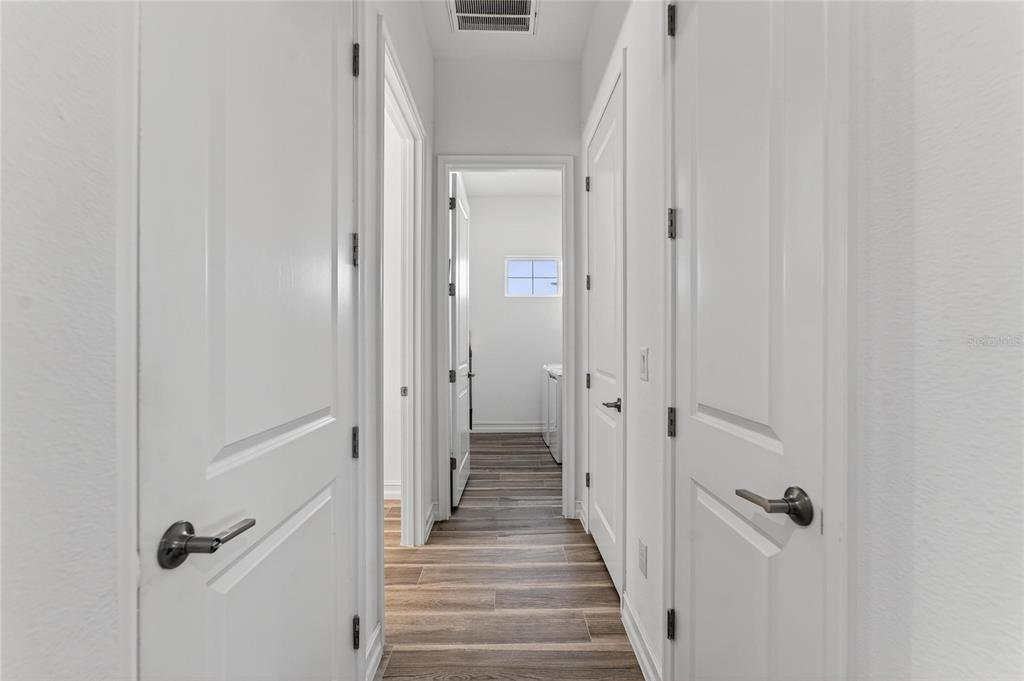 1071 Seagrape Drive Ruskin, FL 33570 - Photo 48 of 100 a view of a hallway with wooden floor and closet area