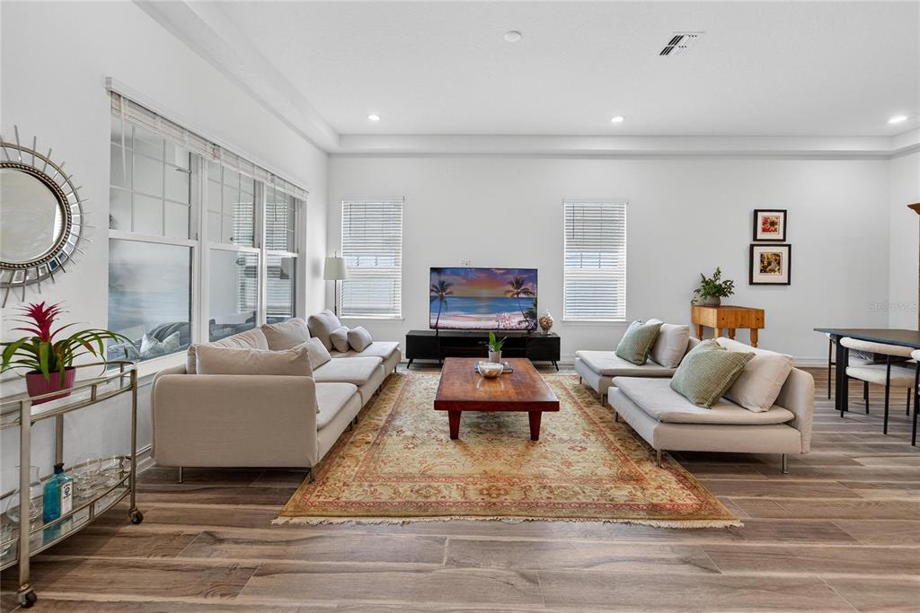 1071 Seagrape Drive Ruskin, FL 33570 - Photo 5 of 100 a living room with furniture and a flat screen tv