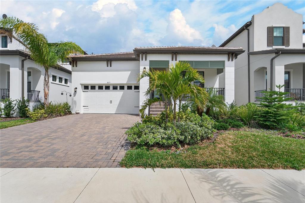 1071 Seagrape Drive Ruskin, FL 33570 - Photo 51 of 100 a front view of a house with garden