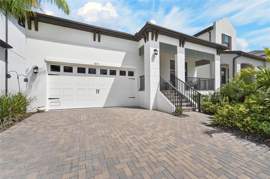 1071 Seagrape Drive Ruskin, FL 33570 - Photo 53 of 100 a front view of a house with a yard