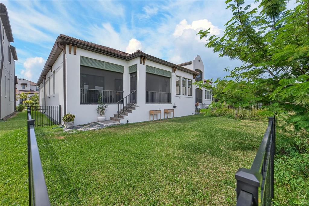 1071 Seagrape Drive Ruskin, FL 33570 - Photo 60 of 100 a front view of house with a garden