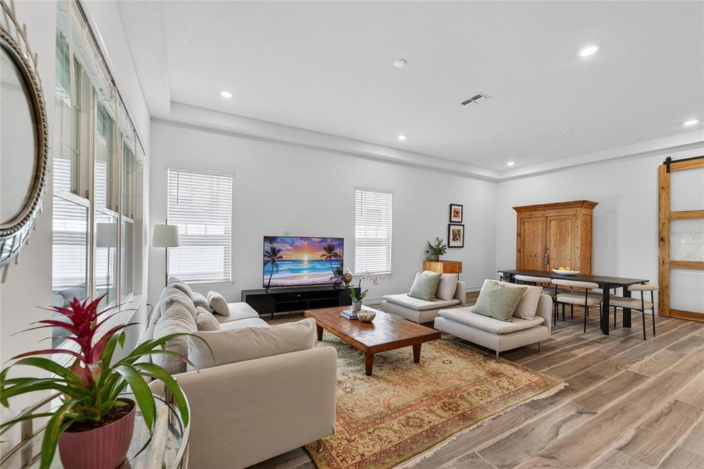 1071 Seagrape Drive Ruskin, FL 33570 - Photo 6 of 100 a living room with furniture fireplace and a large window