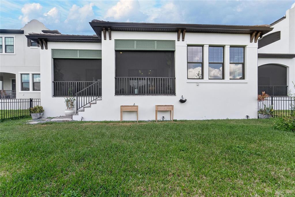 1071 Seagrape Drive Ruskin, FL 33570 - Photo 65 of 100 a view of a house with backyard and a garden