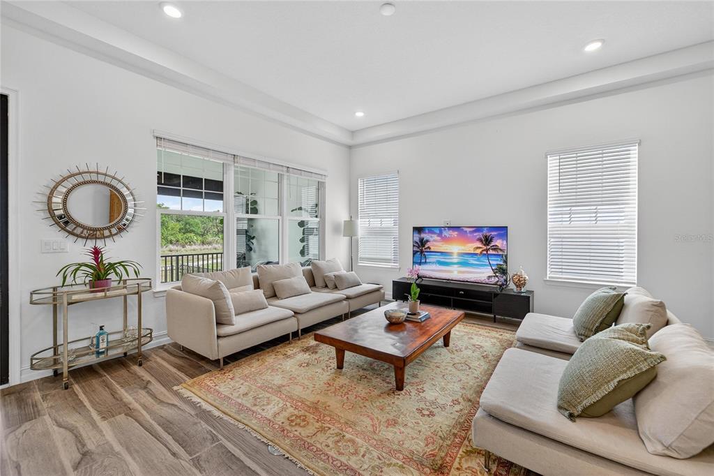 1071 Seagrape Drive Ruskin, FL 33570 - Photo 7 of 100 a living room with furniture and a flat screen tv