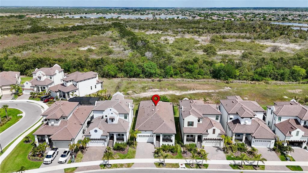 1071 Seagrape Drive Ruskin, FL 33570 - Photo 81 of 100 an aerial view of residential houses with outdoor space and ocean view