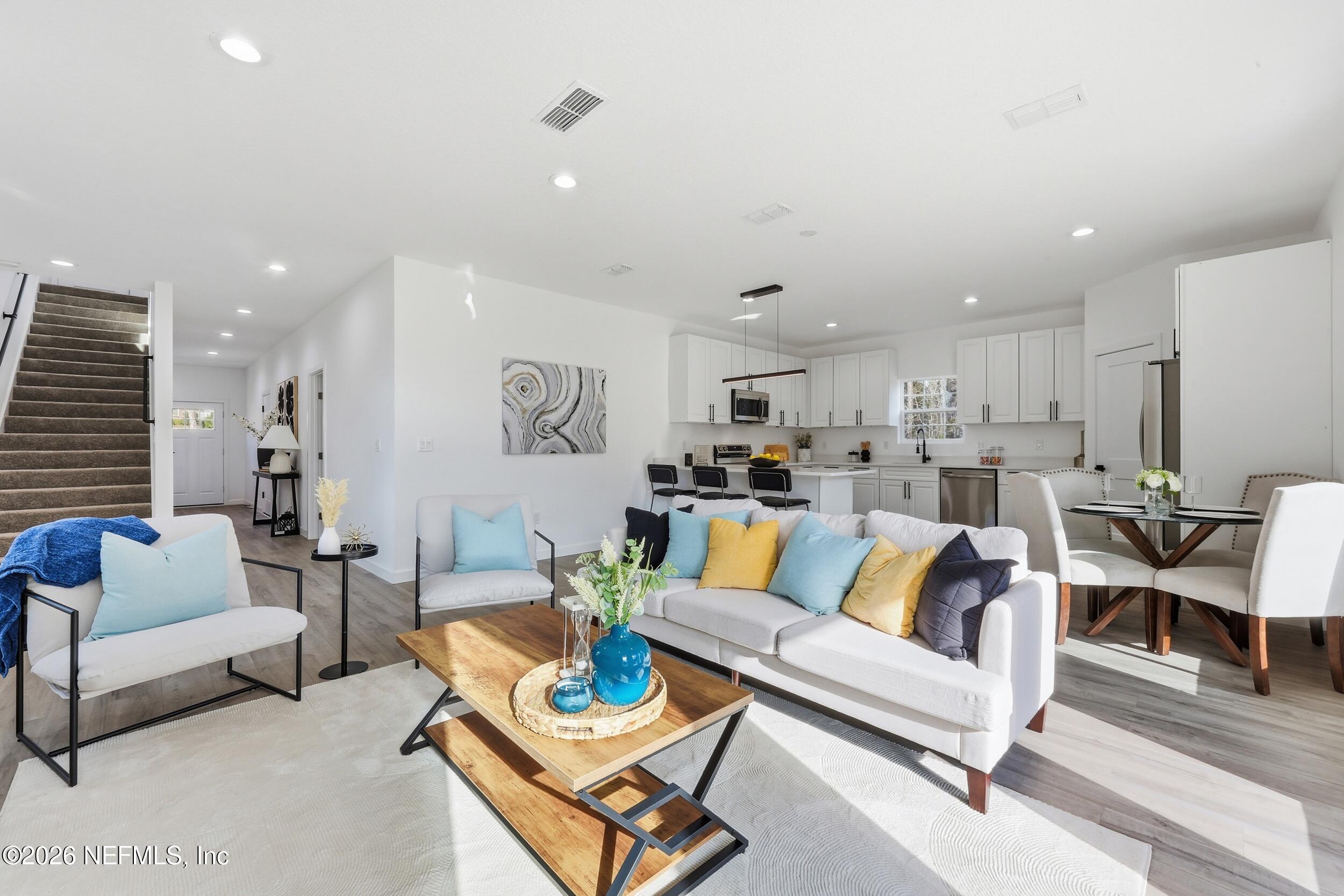 4199 Pine Road Orange Park, FL 32065 - Photo 11 of 44 a living room with furniture kitchen view and a table