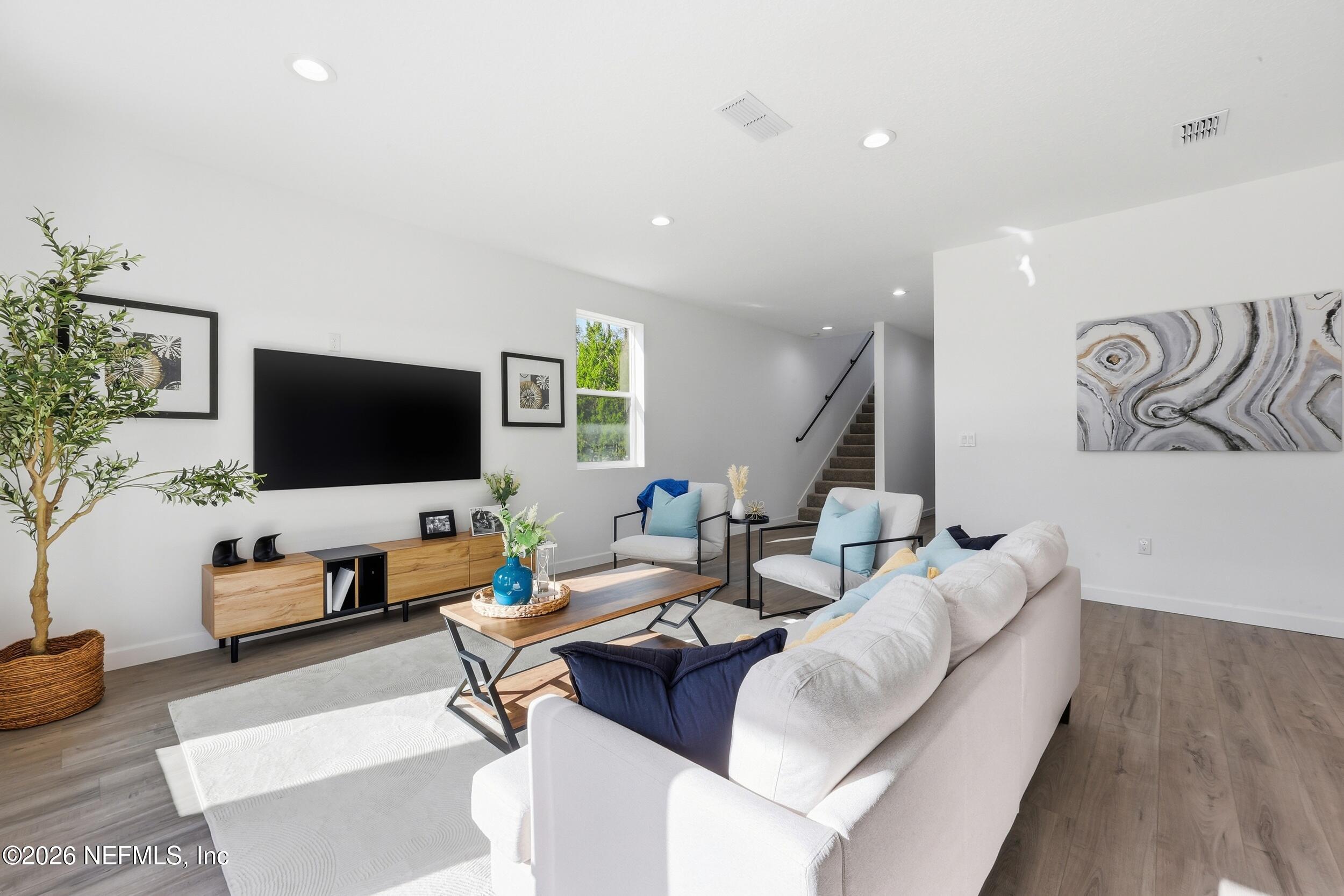 4199 Pine Road Orange Park, FL 32065 - Photo 12 of 44 a living room with furniture and a flat screen tv