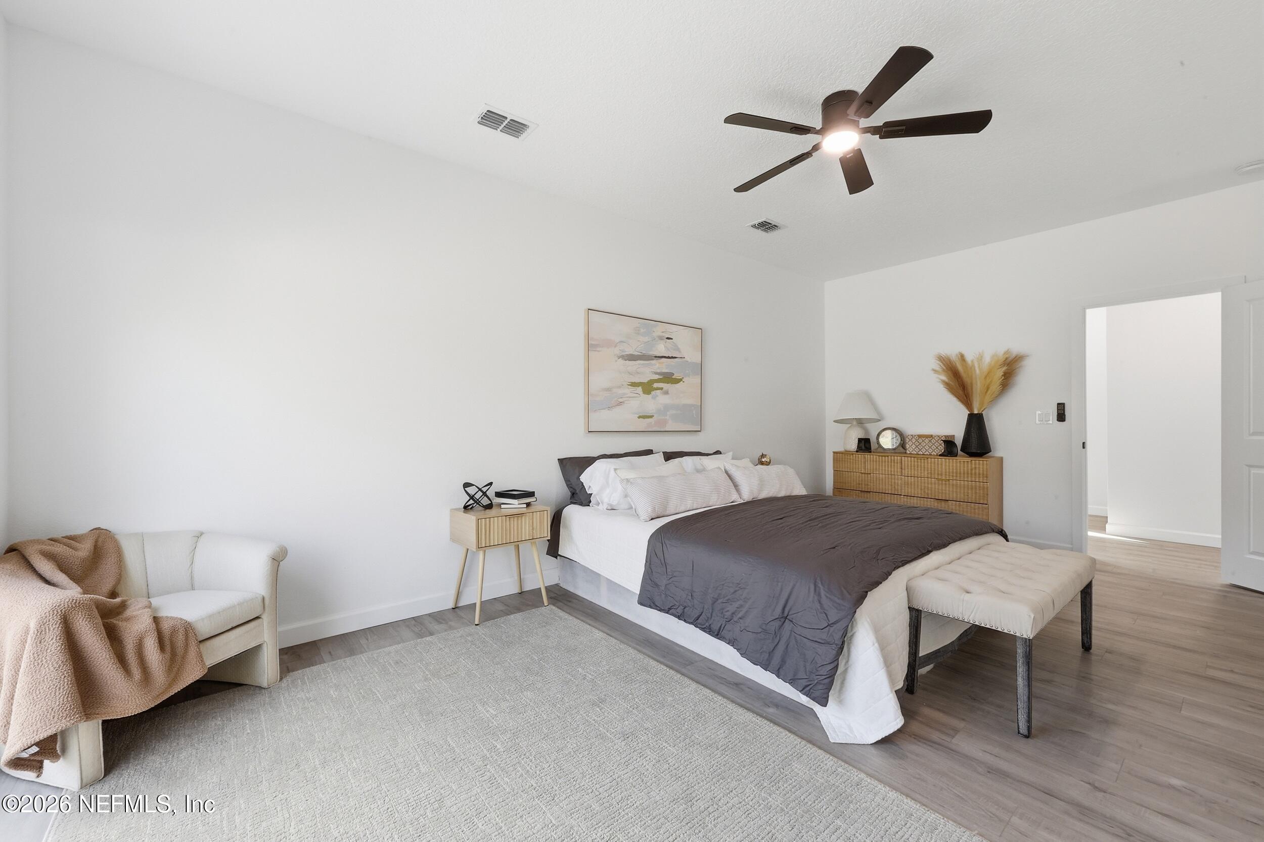 4199 Pine Road Orange Park, FL 32065 - Photo 19 of 44 a bed room with a bed and a couch