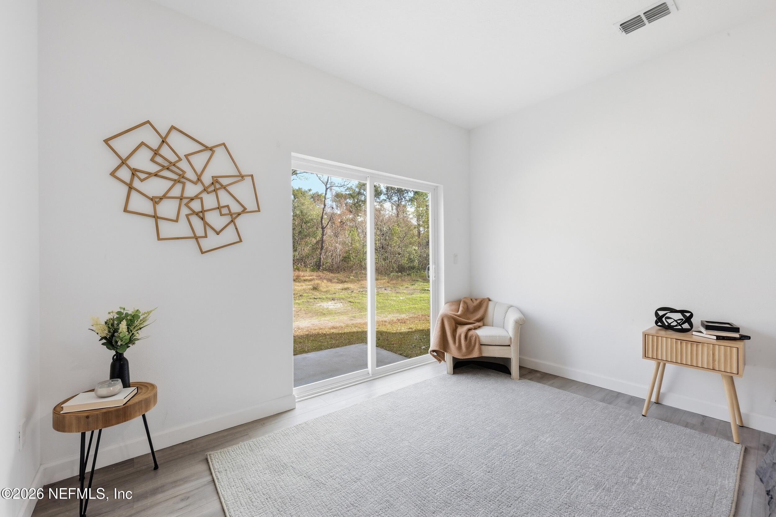 4199 Pine Road Orange Park, FL 32065 - Photo 20 of 44 a living room with furniture and a window