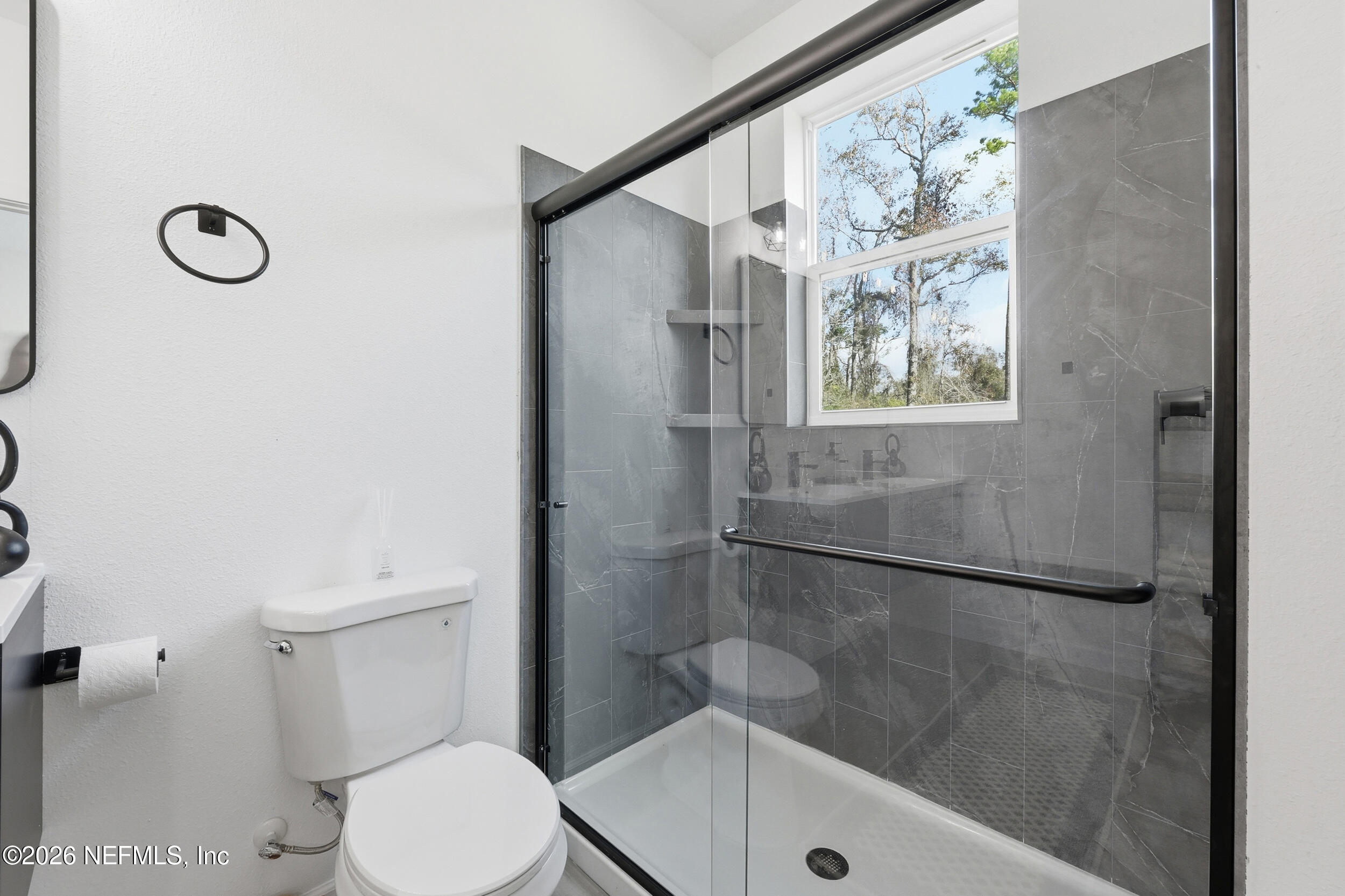 4199 Pine Road Orange Park, FL 32065 - Photo 25 of 44 a bathroom with a toilet and a shower