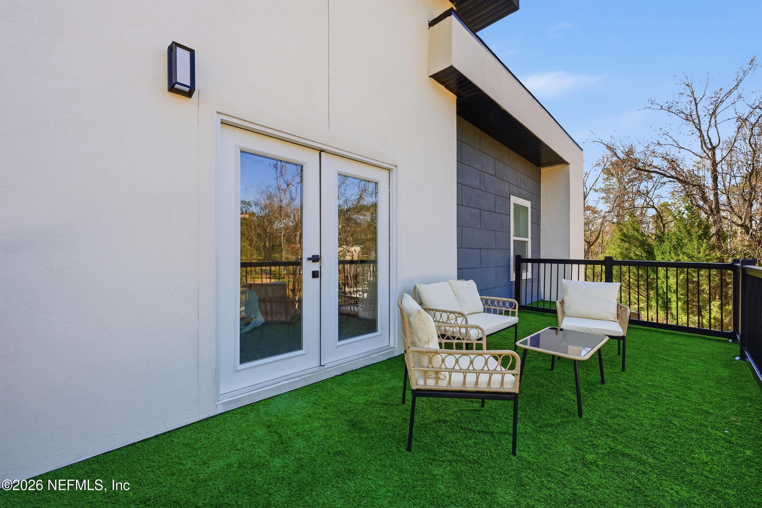 4199 Pine Road Orange Park, FL 32065 - Photo 33 of 44 a view of a chair and table in backyard of the house