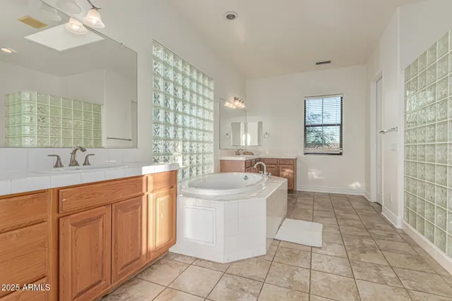 a bedroom with a large bed and a large window