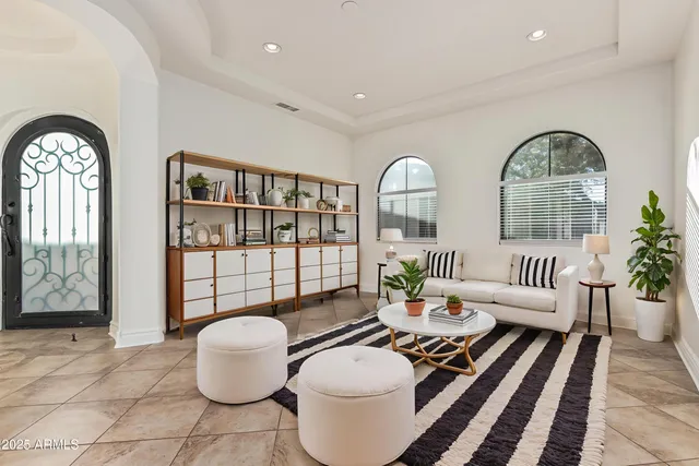 a kitchen with stainless steel appliances granite countertop a stove a sink a microwave a dining table and chairs