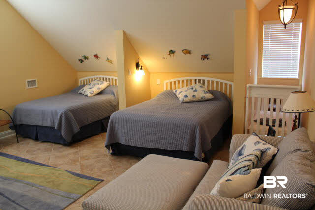4563 Grander Court, Unit 4563 Orange Beach, AL 36561 - Photo 20 of 22 Top Floor Suite, complete with Baby Bed, TV, Sitting Area and full bath.