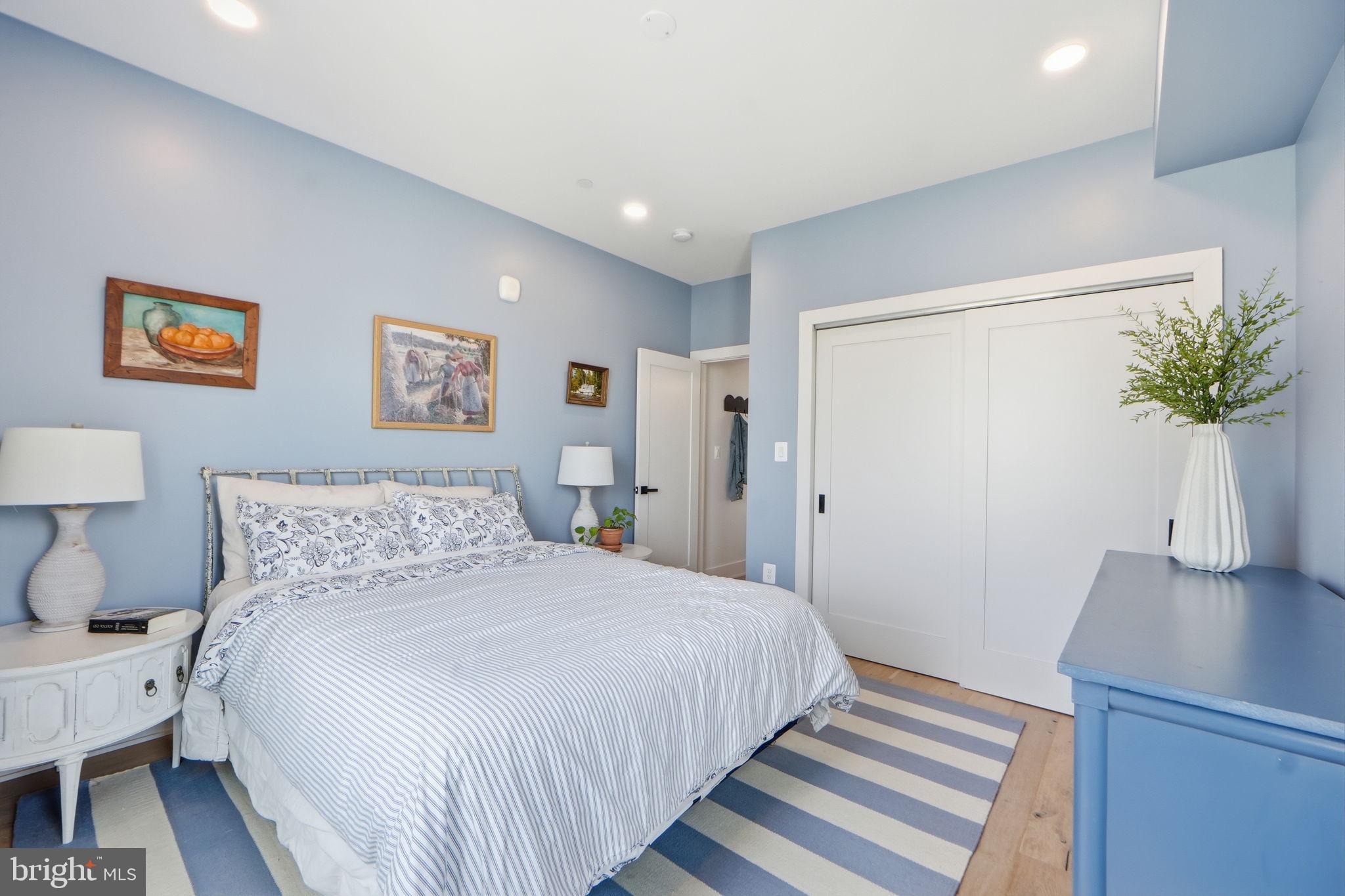623 Kennedy Street Northwest, Unit 10 Washington, DC 20011 - Photo 15 of 34 a bedroom with a bed and a potted plant