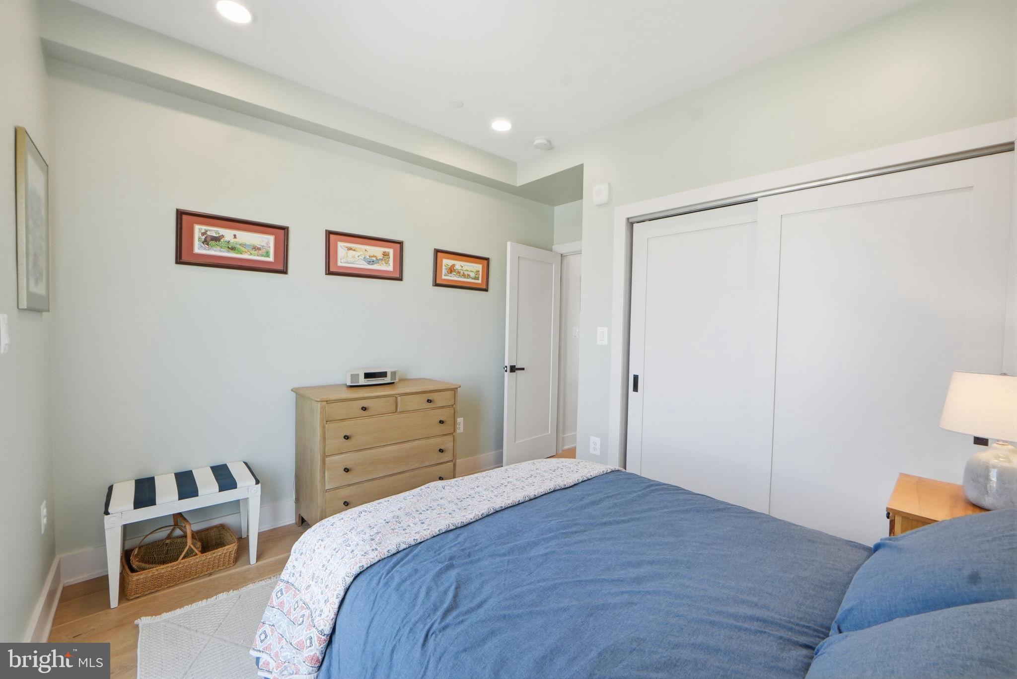623 Kennedy Street Northwest, Unit 10 Washington, DC 20011 - Photo 24 of 34 a bedroom with a bed and cabinets