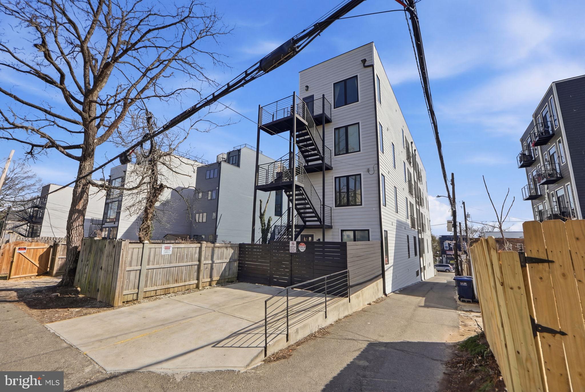 623 Kennedy Street Northwest, Unit 10 Washington, DC 20011 - Photo 31 of 34 a view of a brick house with many windows