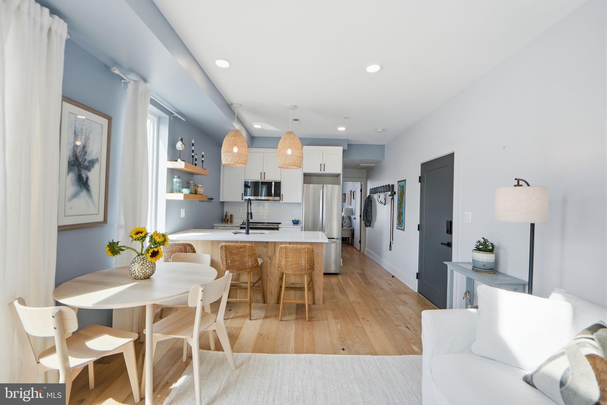 623 Kennedy Street Northwest, Unit 10 Washington, DC 20011 - Photo 5 of 34 a large kitchen with a table and chairs