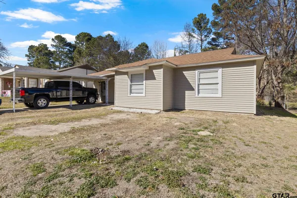a view of house with a outdoor space