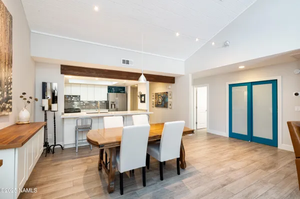 a dining room with furniture and window