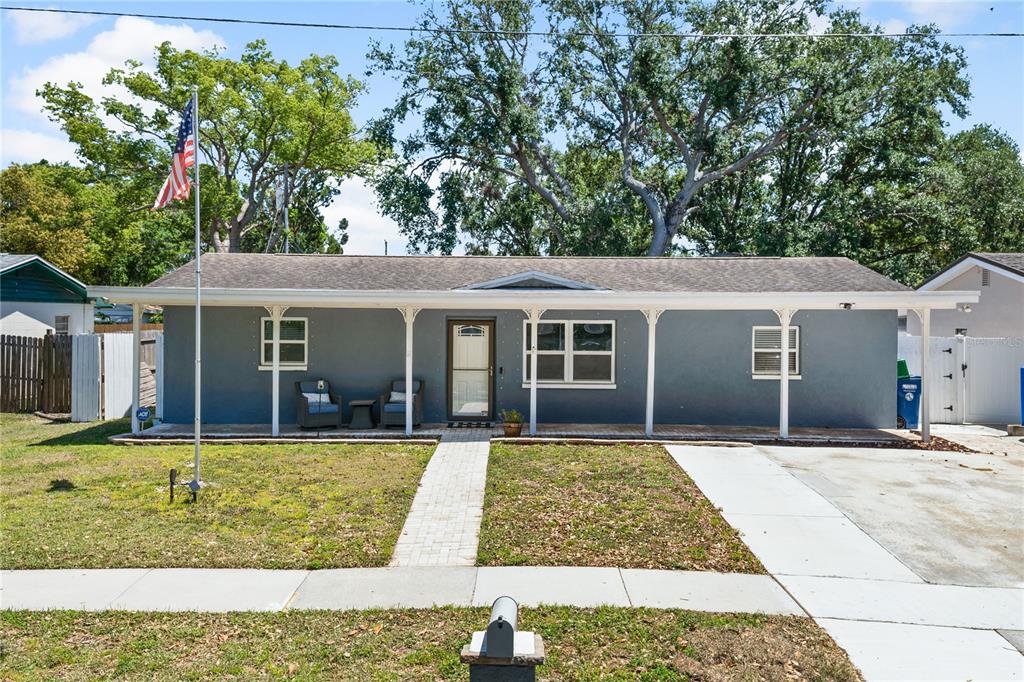 9653 Golden Grove Street Seminole, FL 33772 - Photo 1 of 29 a view of a house with garden