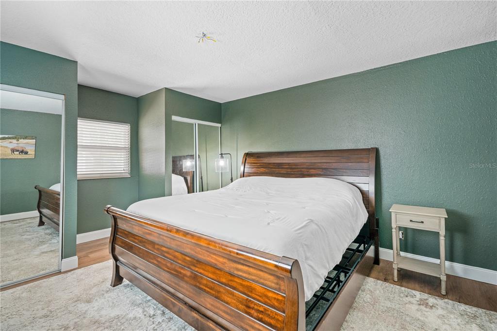 9653 Golden Grove Street Seminole, FL 33772 - Photo 11 of 29 a bed sitting in a bedroom next to a window