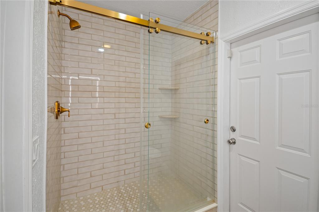 9653 Golden Grove Street Seminole, FL 33772 - Photo 13 of 29 a bathroom with a shower