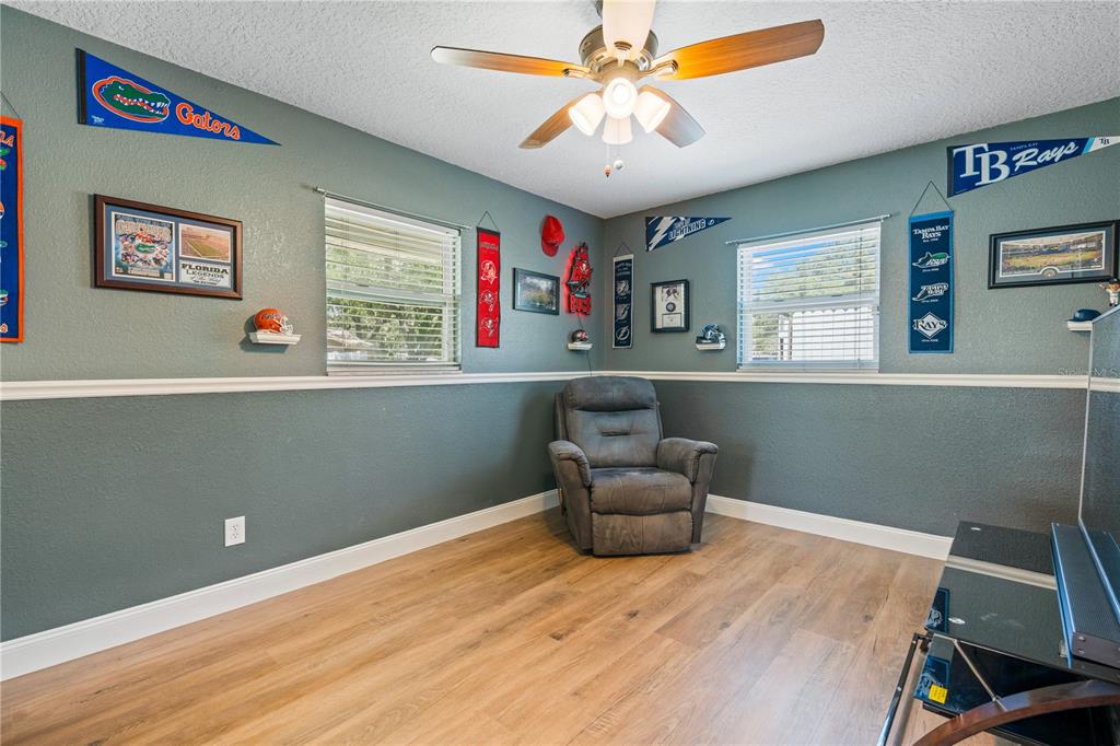 9653 Golden Grove Street Seminole, FL 33772 - Photo 15 of 29 a workspace with wooden floor and windows