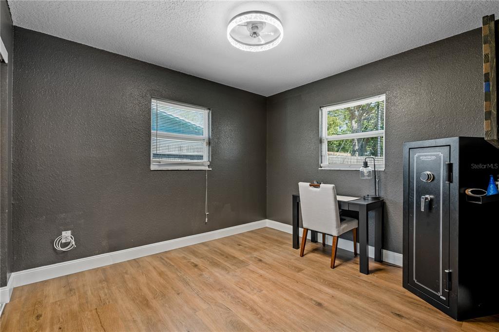 9653 Golden Grove Street Seminole, FL 33772 - Photo 17 of 29 a view of a room with a window and wooden floor