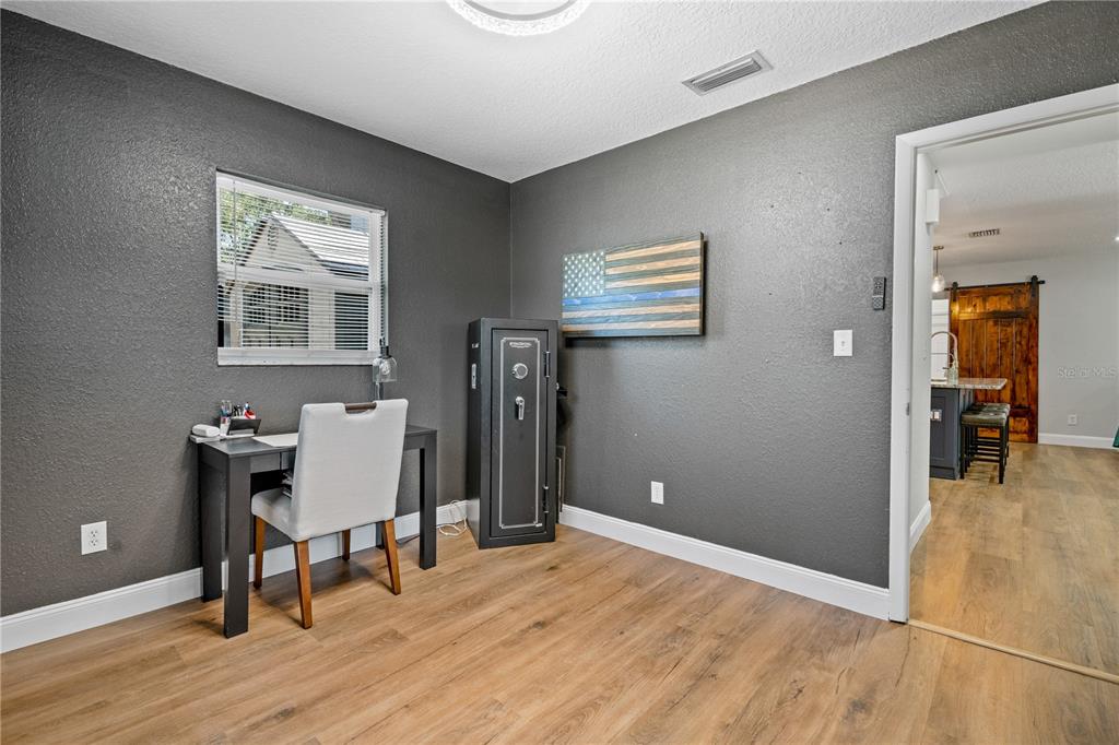 9653 Golden Grove Street Seminole, FL 33772 - Photo 18 of 29 a workspace with wooden floor and a workspace