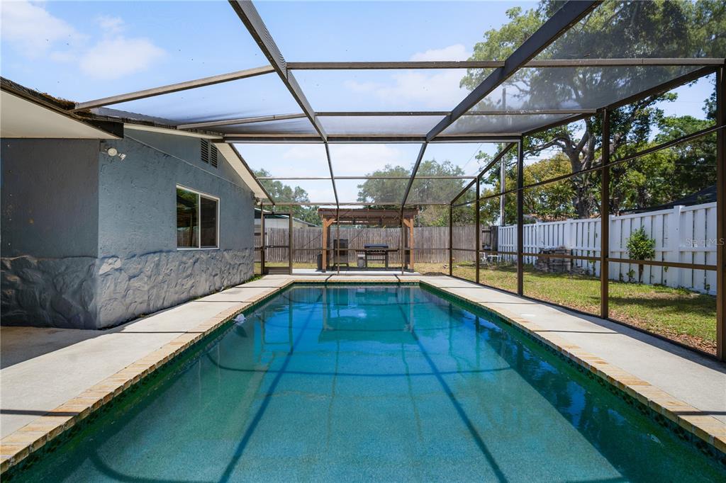 9653 Golden Grove Street Seminole, FL 33772 - Photo 22 of 29 a view of a swimming pool