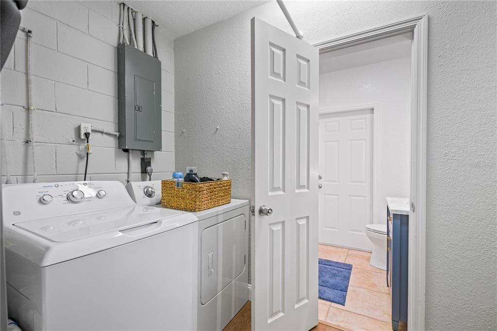 9653 Golden Grove Street Seminole, FL 33772 - Photo 23 of 29 a utility room with dryer and washer